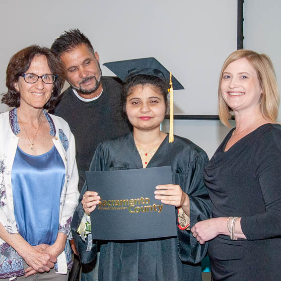 Student holding certificate