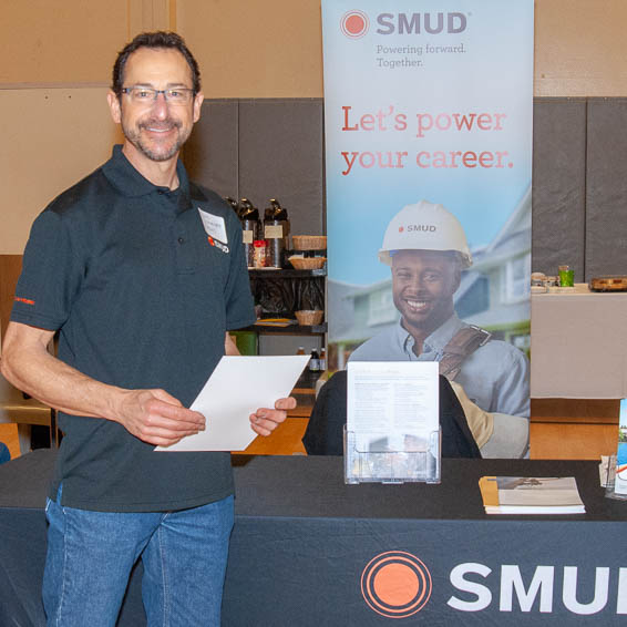 SMUD representative at information table