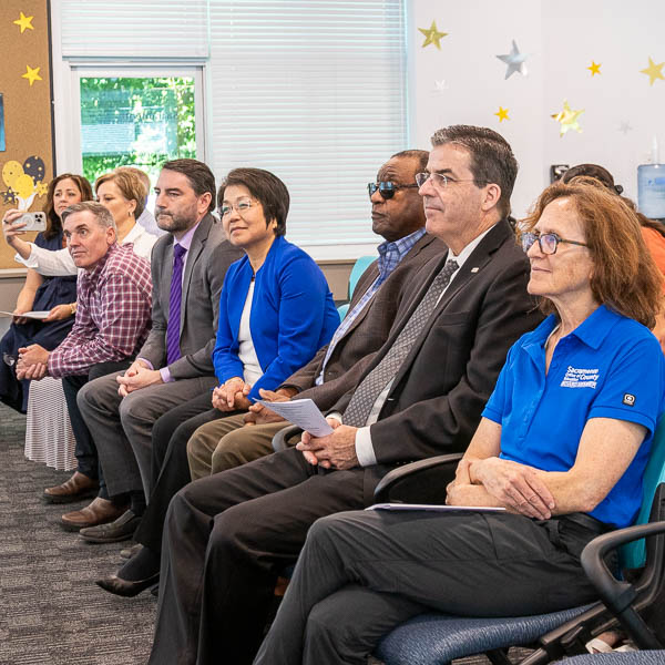 Audience watching graduation ceremony