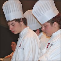 Student chefs wearing chef hats