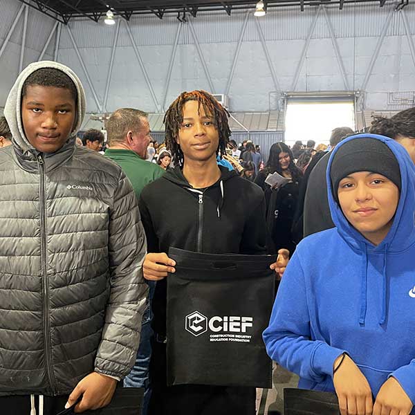 Students posing with CIEF bags