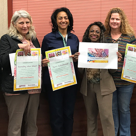 Teachers holding calendars