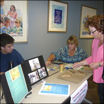 Student selling handmade wood items