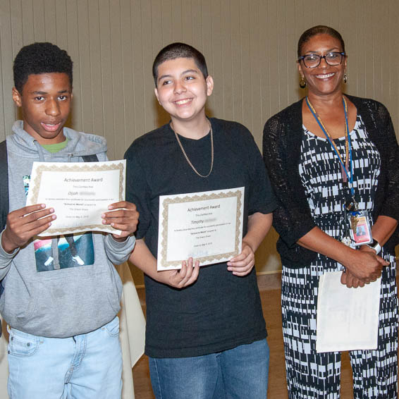 Students holding certificates