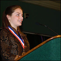 Morgan Steele at lectern delivering speech