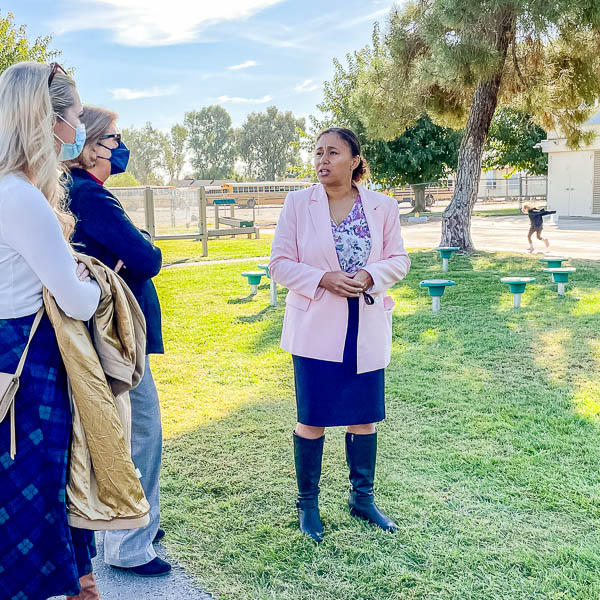 Visitors observing a school playground