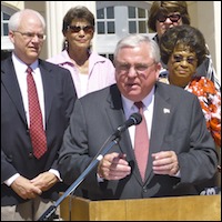 David W. Gordon speaking at podium