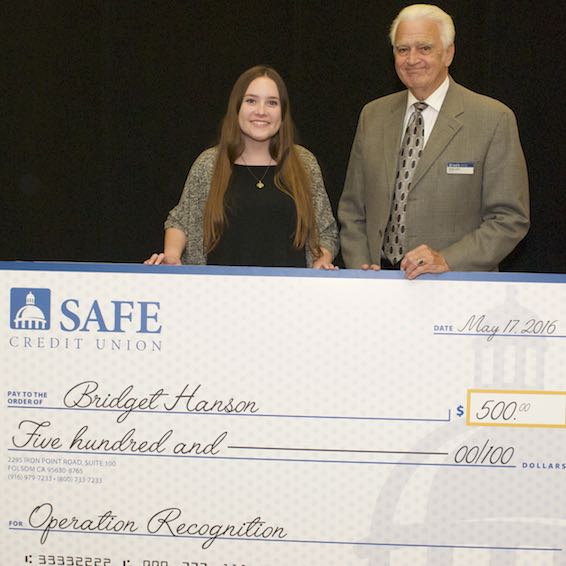 Bridget Hanson receiving giant check from Herb Long