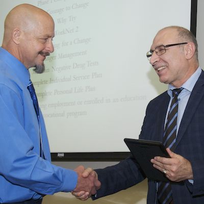 DRC graduate shaking hands