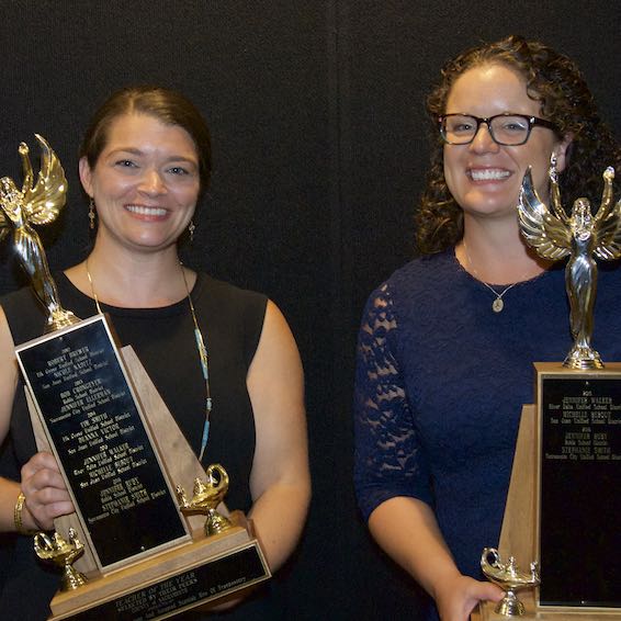 Jennifer Ruby and Stephanie Smith holding trophies