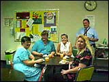 Group of staff enjoying cake