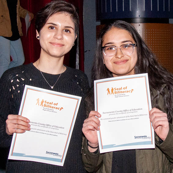Students holding certificates