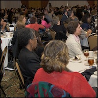 Seated audience listening to speakers