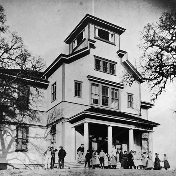 Black and white photo of an old schoolhouse