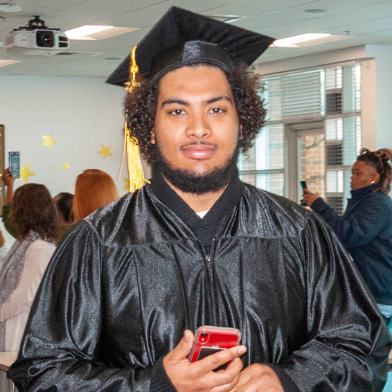 Graduate wearing cap and gown