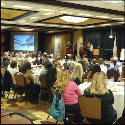 Audience seated in front of stage