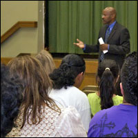 Families listen to a presentation