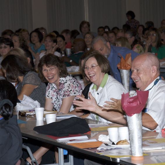 Audience members smiling