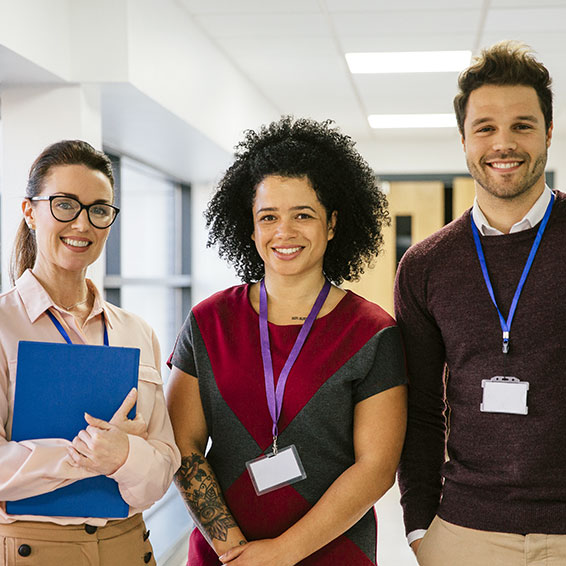 Teachers standing in hallway outside classroom