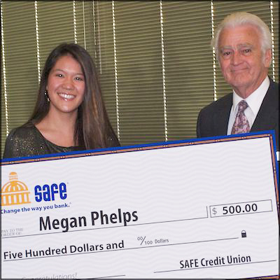 Megan Phelps and Herb Long holding $500 scholarship check