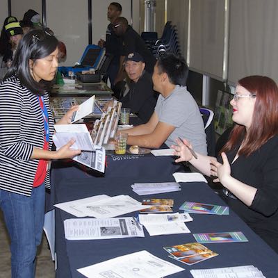 Student receiving information from a visiting representative