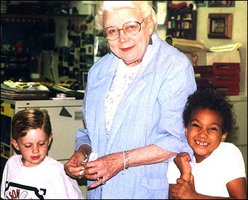 Volunteer Karyl Meyers with students