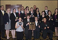 Students with plaques
