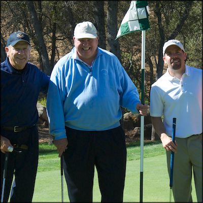 Superintendent posing with golfers