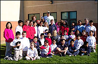 Group of students posing with Doug Christie and Denise Phillips