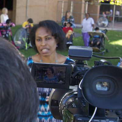 Okemiri being interviewed by a News10 videographer