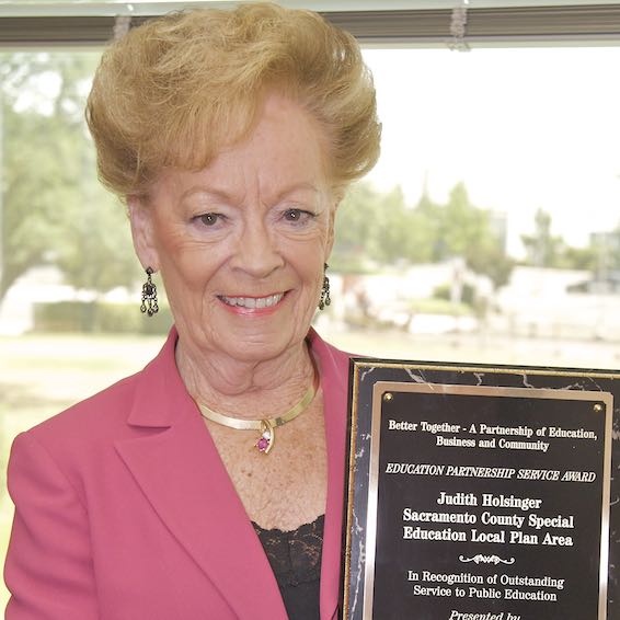 Judy Holsinger holding plaque