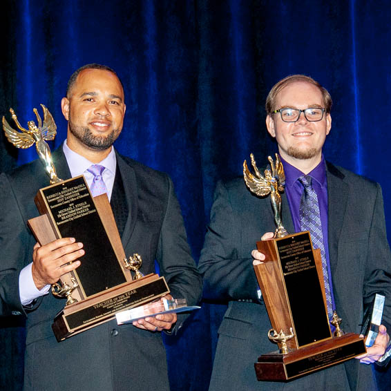 Brandon Parker and Michael Steele holding trophies