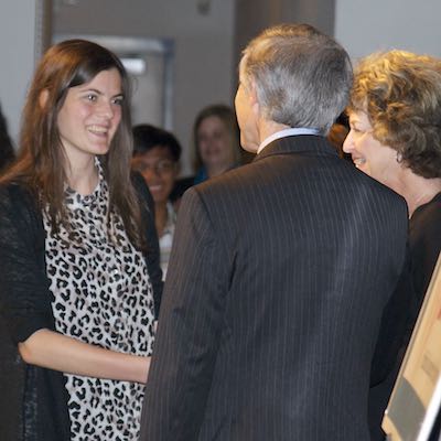 Student shaking hands with Board member