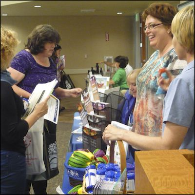 Vendors speaking with attendees