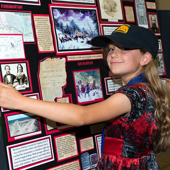 Girl carrying history display