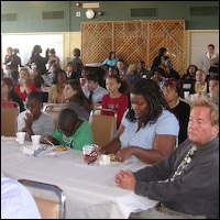 Audience seated at tables