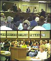 Wide shots of Board room during oath of office