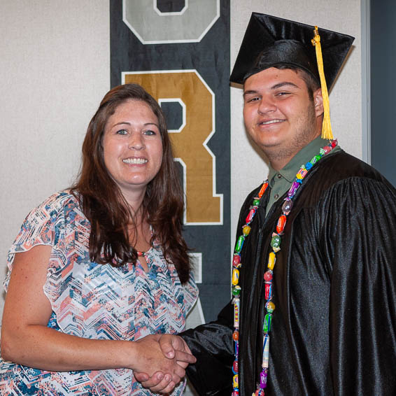 Graduate shaking hands