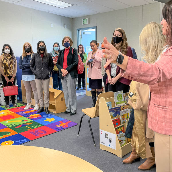 Group of visitors touring a classroom