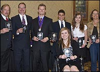 Students with plaques