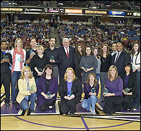 Teachers of the Year posing on ARCO Arena court