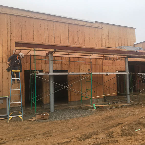 Construction photo showing a partially built building