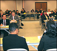 Seated panelists address the audience