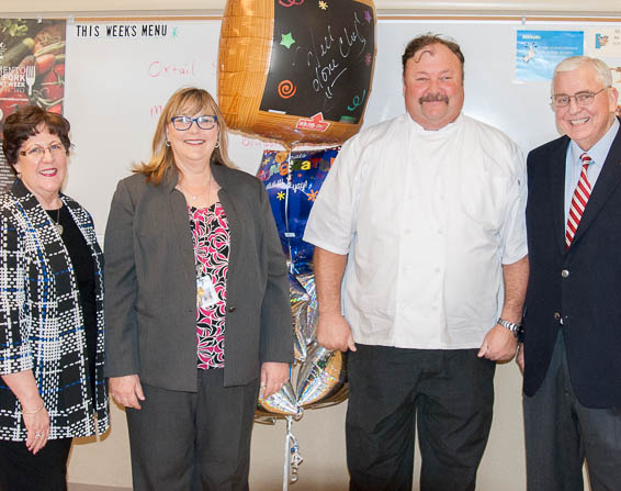 Robin Pierson, Lauren Roth, and Dave Gordon presenting balloons to Jeff Zahniser