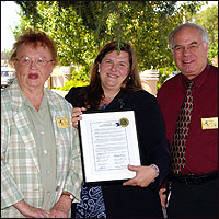 Elinor Hickey and David P. Meaney presenting certificate to Michele Mickela