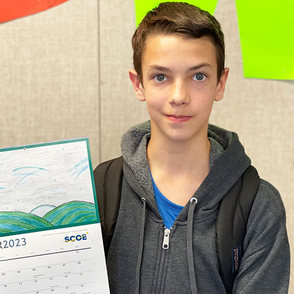 Ben P. holding a calendar