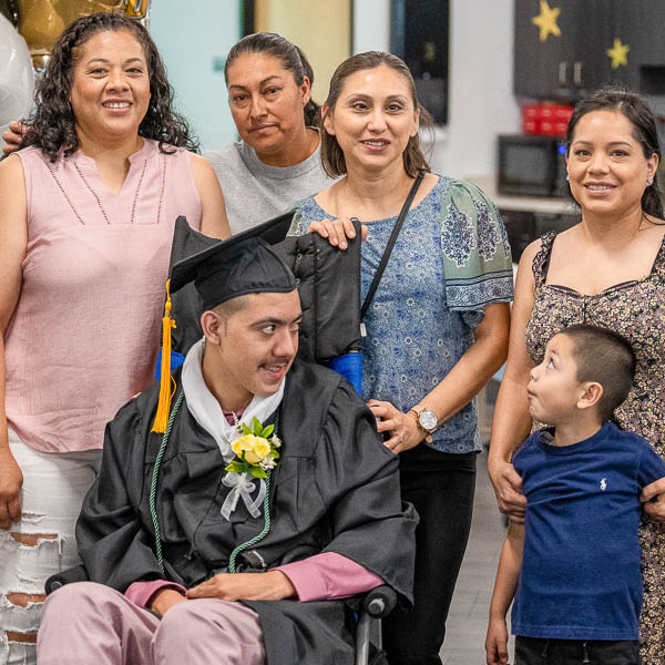 Student smiling with family members