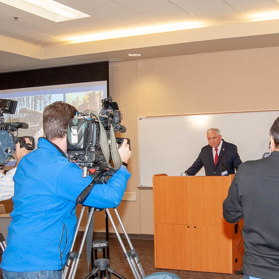 David Gordon in front of TV news cameras