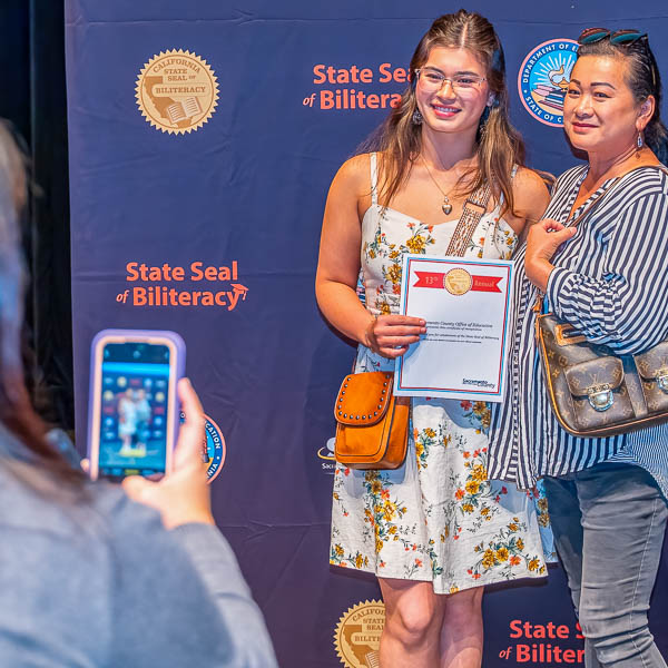 Student posing with parent