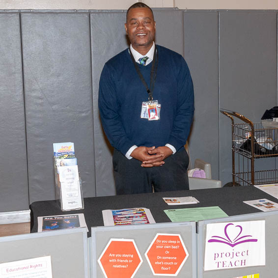 Project TEACH representative at information table